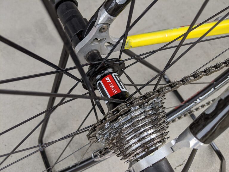 Closeup of a DT Swiss hub & 9 speed cassette on a Paconi Airplane road bike