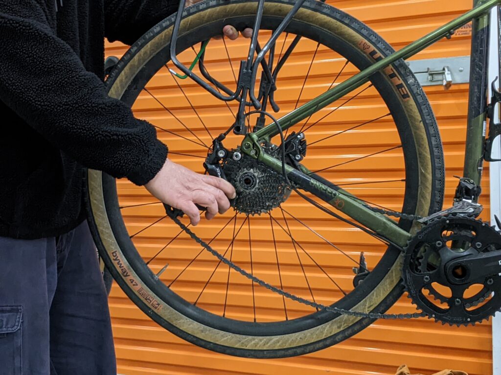 Removing a mountain bike wheel during the 1226 Backyard Bicycle Mechanic Drivetrain Course in Maribyrnong